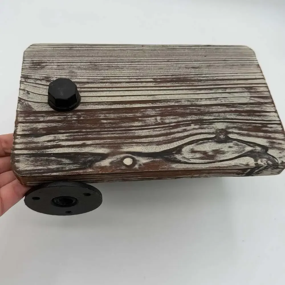 industrial-style wall-mounted toilet paper holder with a rustic wood top shelf